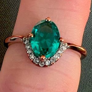 Stamped sterling silver 18k plated gold with blue topaz and diamond accents.